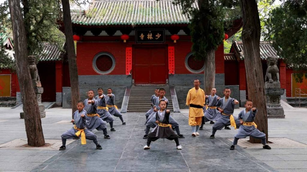 shaolin students practicing kung fu with their masters