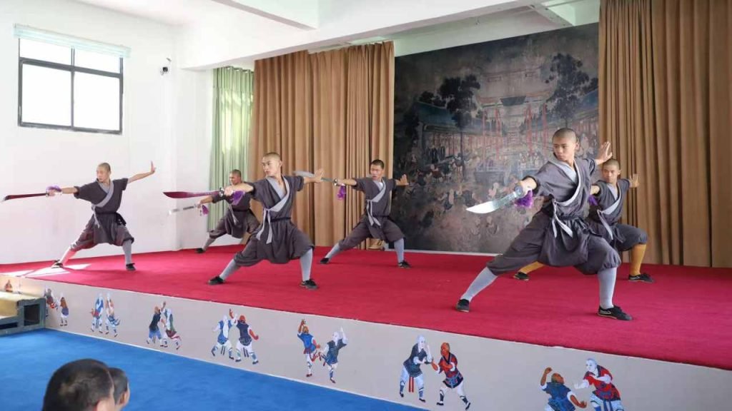 Chinese kung fu disciples peforming with the sword at one of the shows