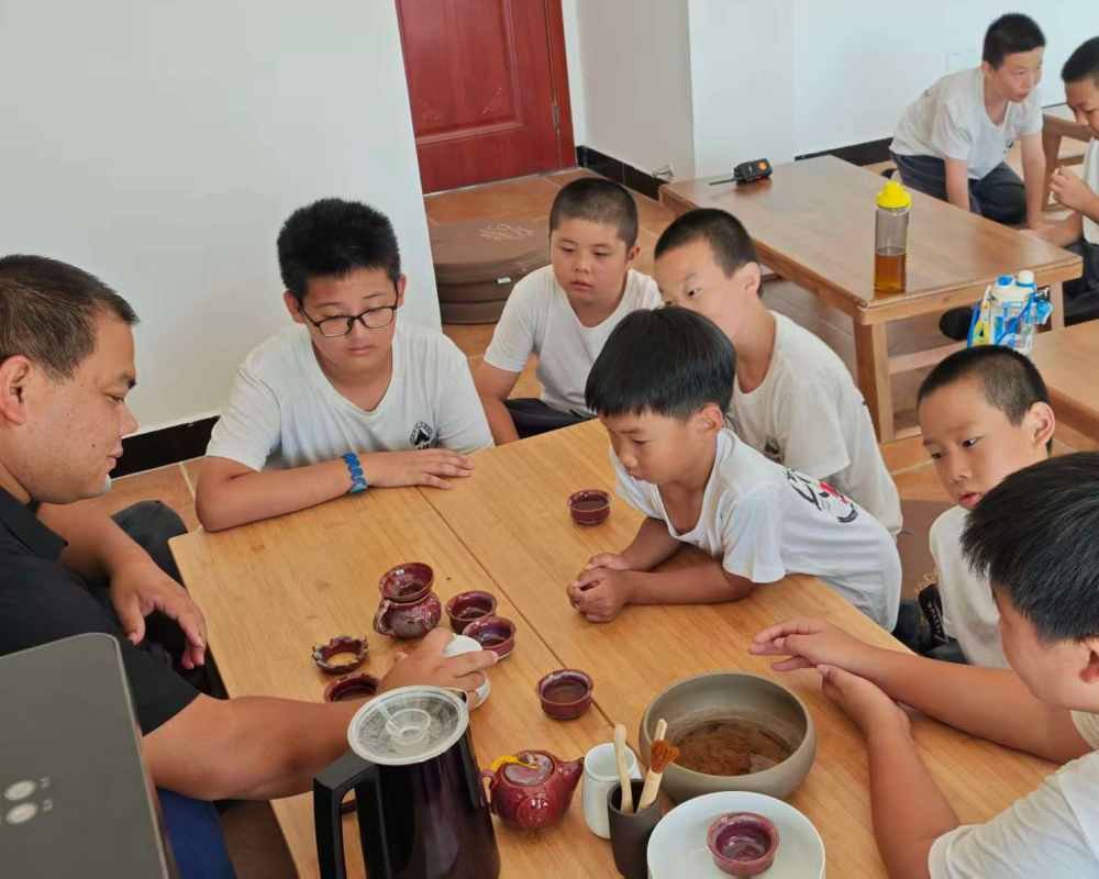 image shows young disciples learning about kung fu tea and zen tea ceremony