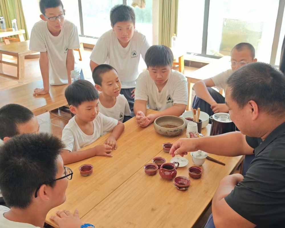 image shows disciples and master learning about shaolin kung fu tea