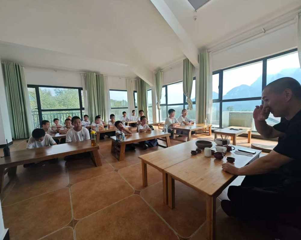 image shows students taking lecture in one of the classes at Shaolin pastoral kung fu school